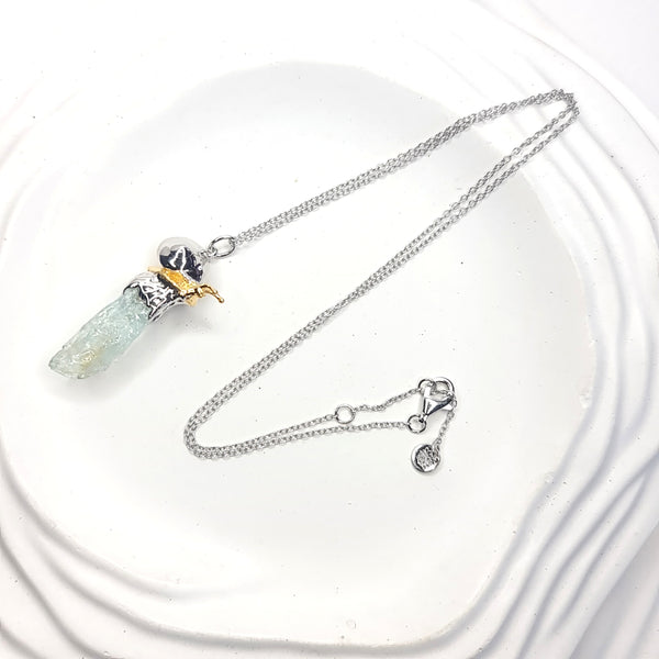 Sea Snail and Raw Aquamarine