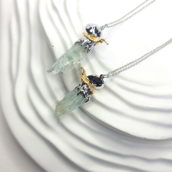 Sea Snail and Raw Aquamarine